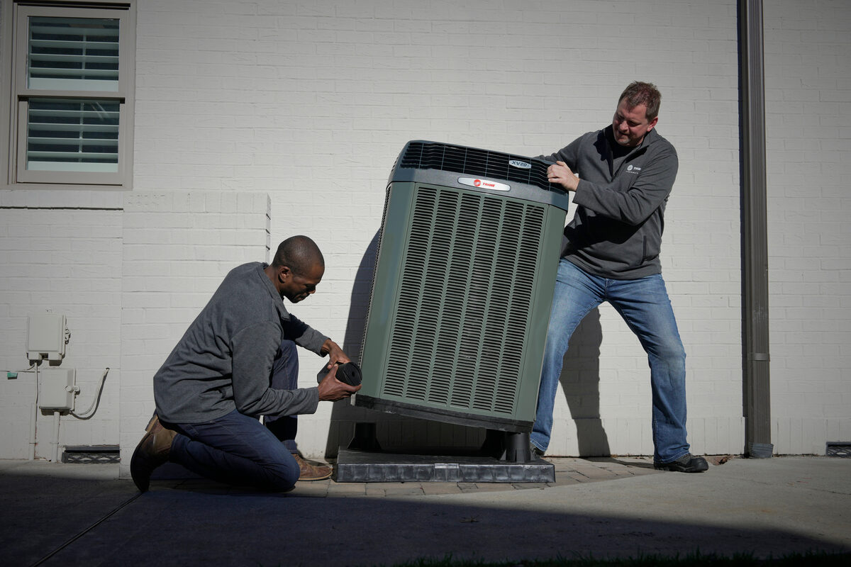 Trane specialist installing an outdoor HVAC equipment